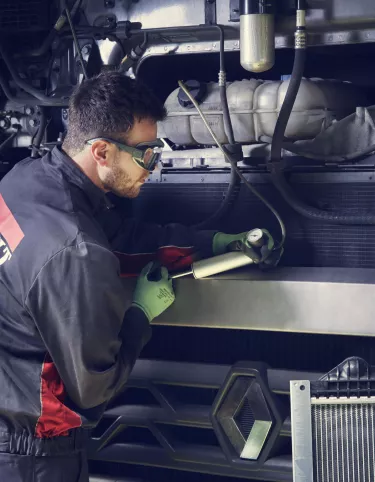 Man repairing trucks